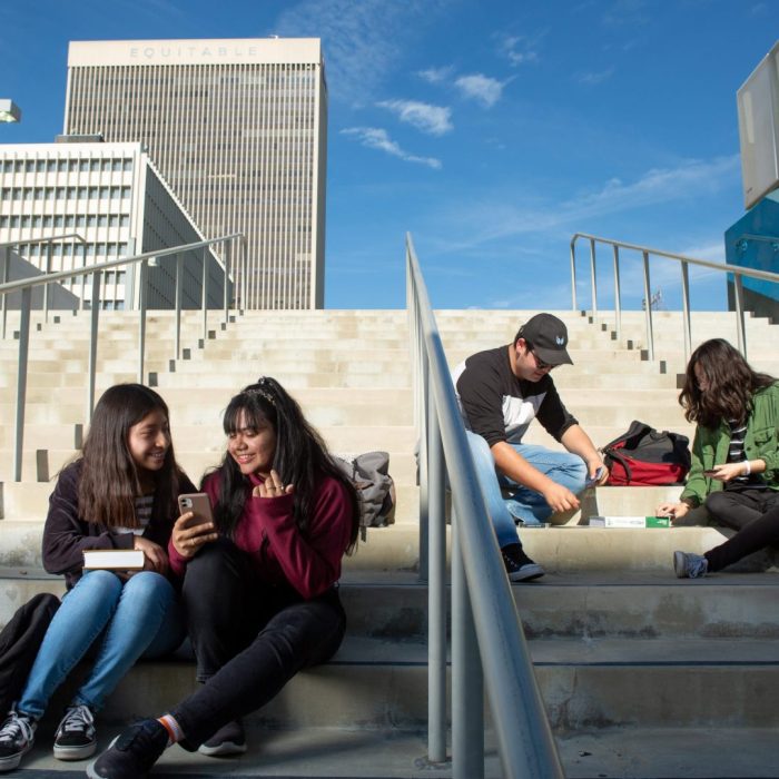 High school students gather on the stairs between classes. Source: All4Ed