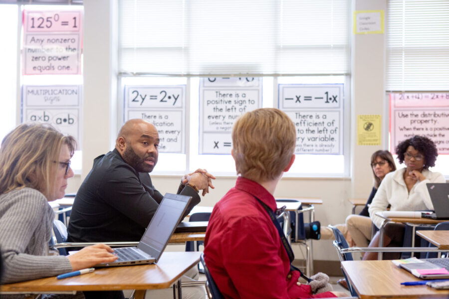 Sixth-grade math teachers discuss their lessons during a team planning session.