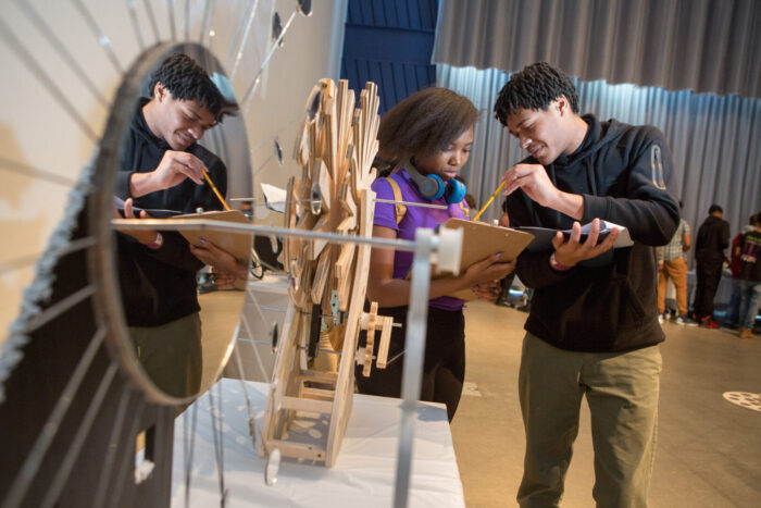 Students from MC2 STEM High School critique their classmates’ projects for an event that blends STEM and art.